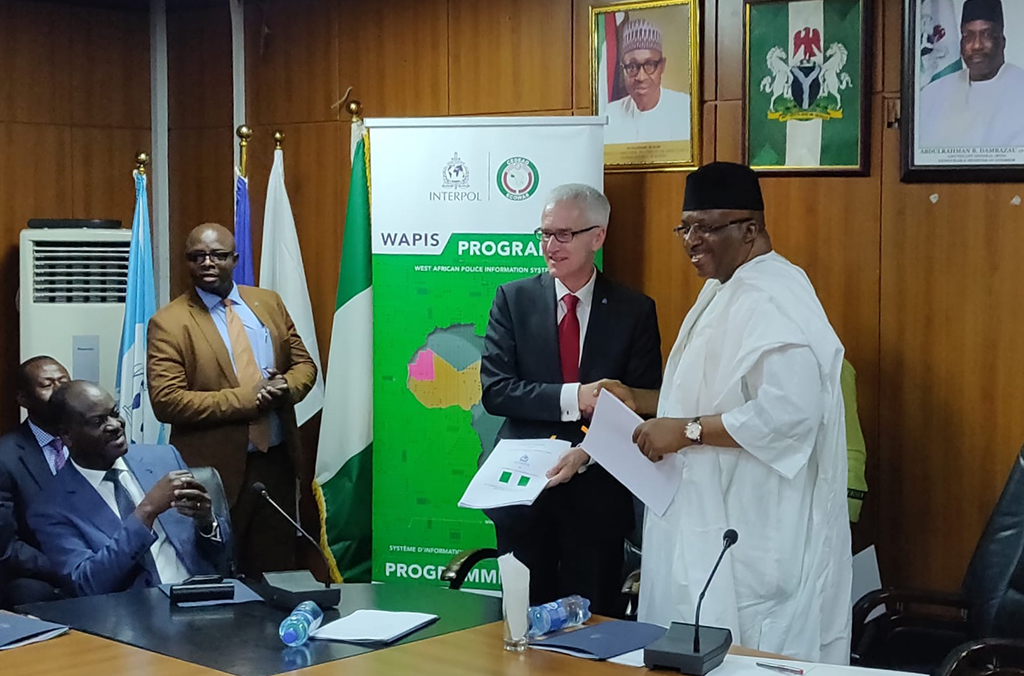 The agreement signing ceremony with Nigeria’s Minister of the Interior and INTERPOL Secretary General Jürgen Stock for the implementation of the West African Police Information System programme.